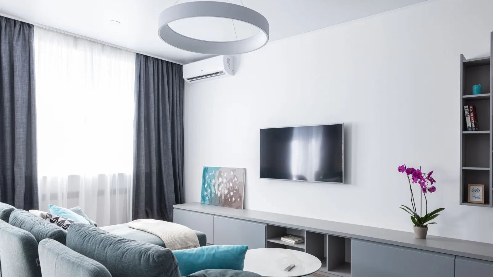 Best 120V plug in DIY mini split — a wall-mounted 115V ductless indoor unit heating and cooling a bright living room