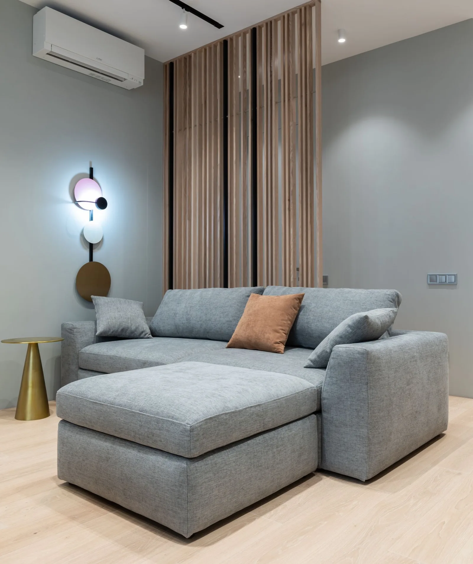 Wall-mounted Mitsubishi-style indoor unit in a living room, relevant to msz-fs vs msz-gl comparison
